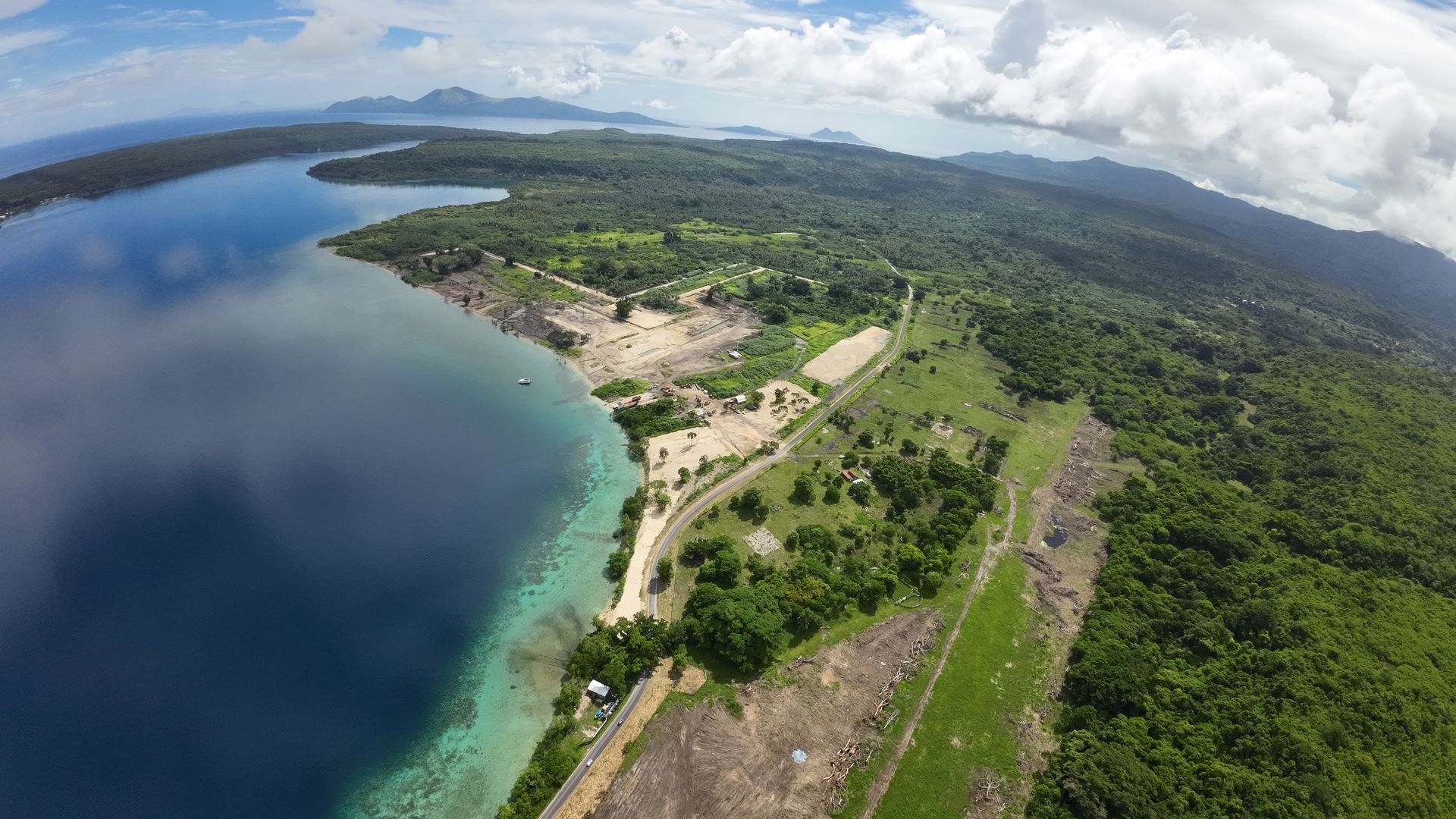 Aerial view along the Havannah Harbour shoreline and the Efate Ring Road, with the marina construction site in the middle of the photo and lot 122 in the foreground.